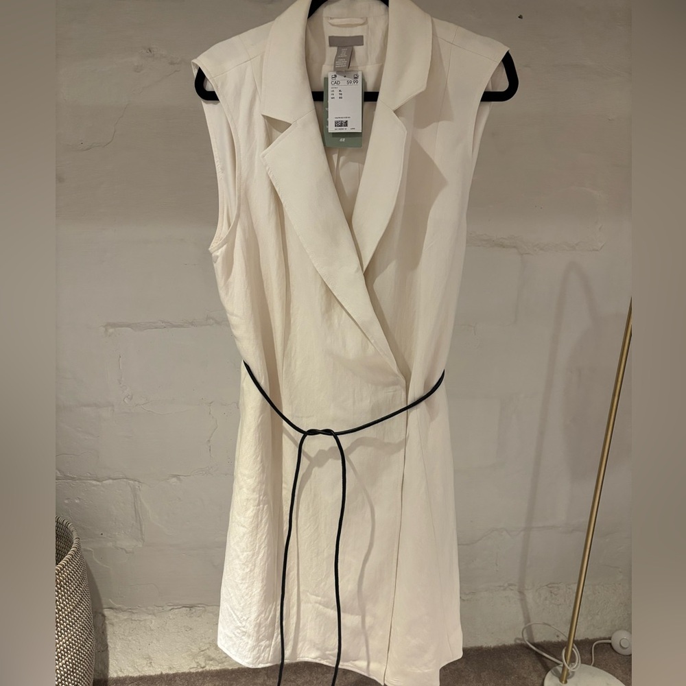 Sleeveless White Wrap Dress with Black Tie